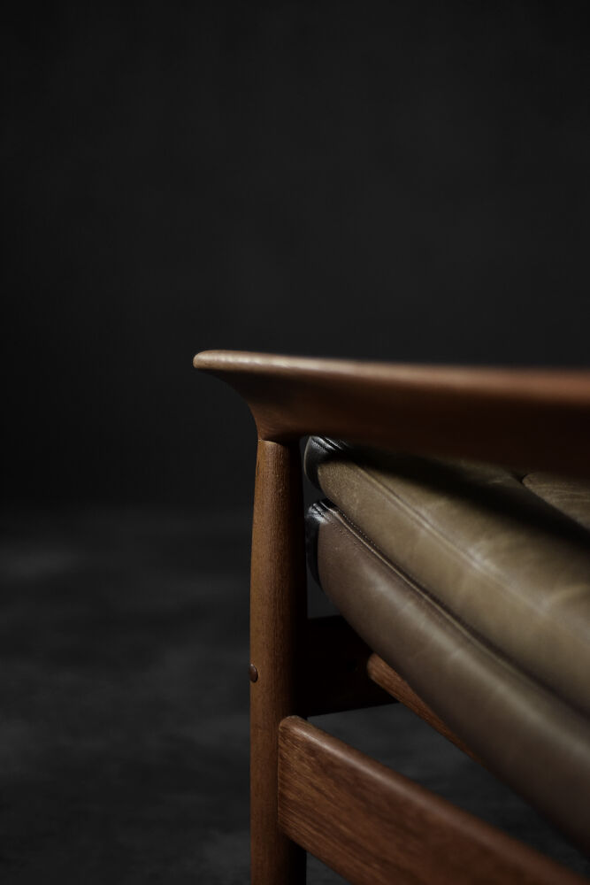 High teak and brown leather armchair with reclining backrest, mid-century Danish style, 1960s.