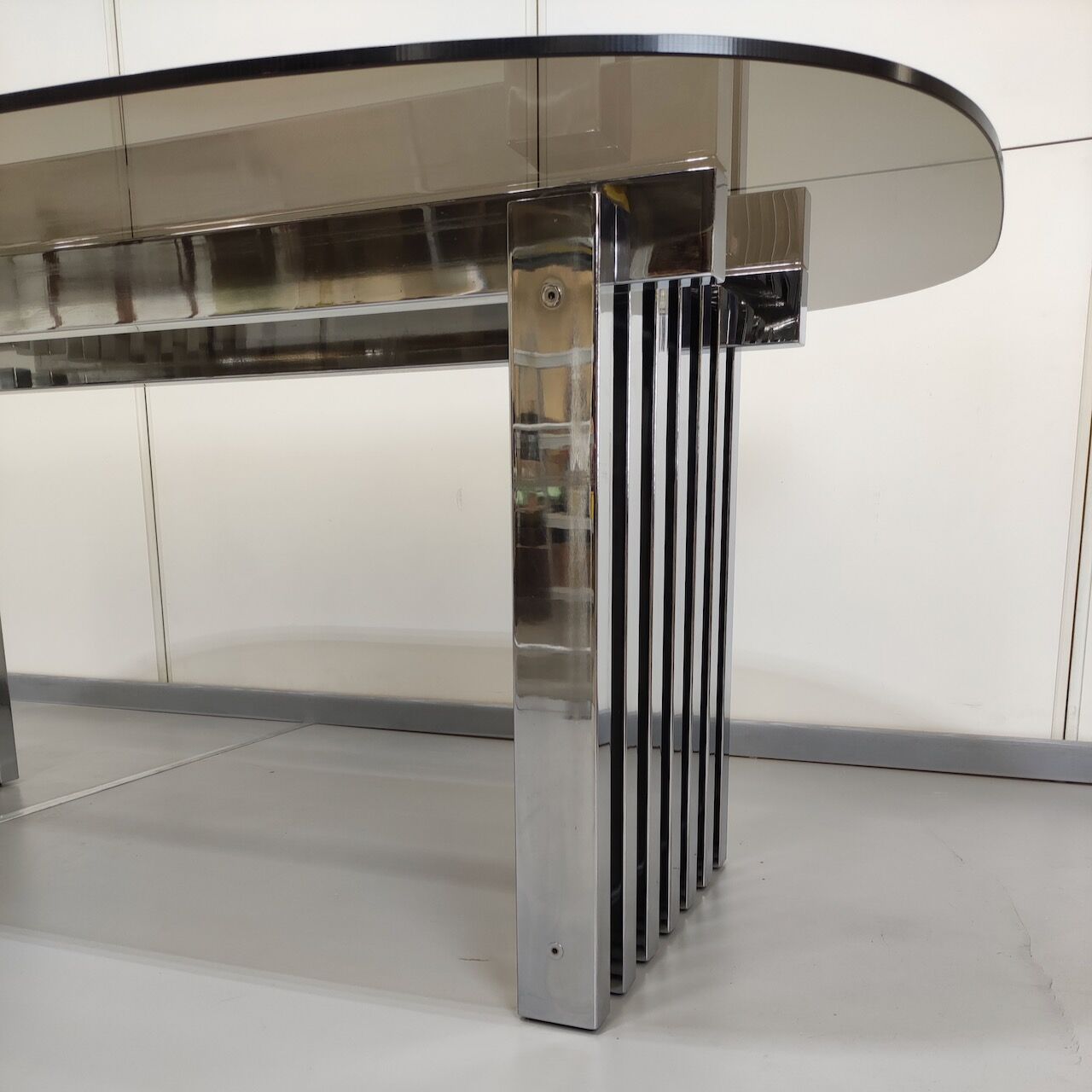 Chrome base diningroom table with smoked glass oval top