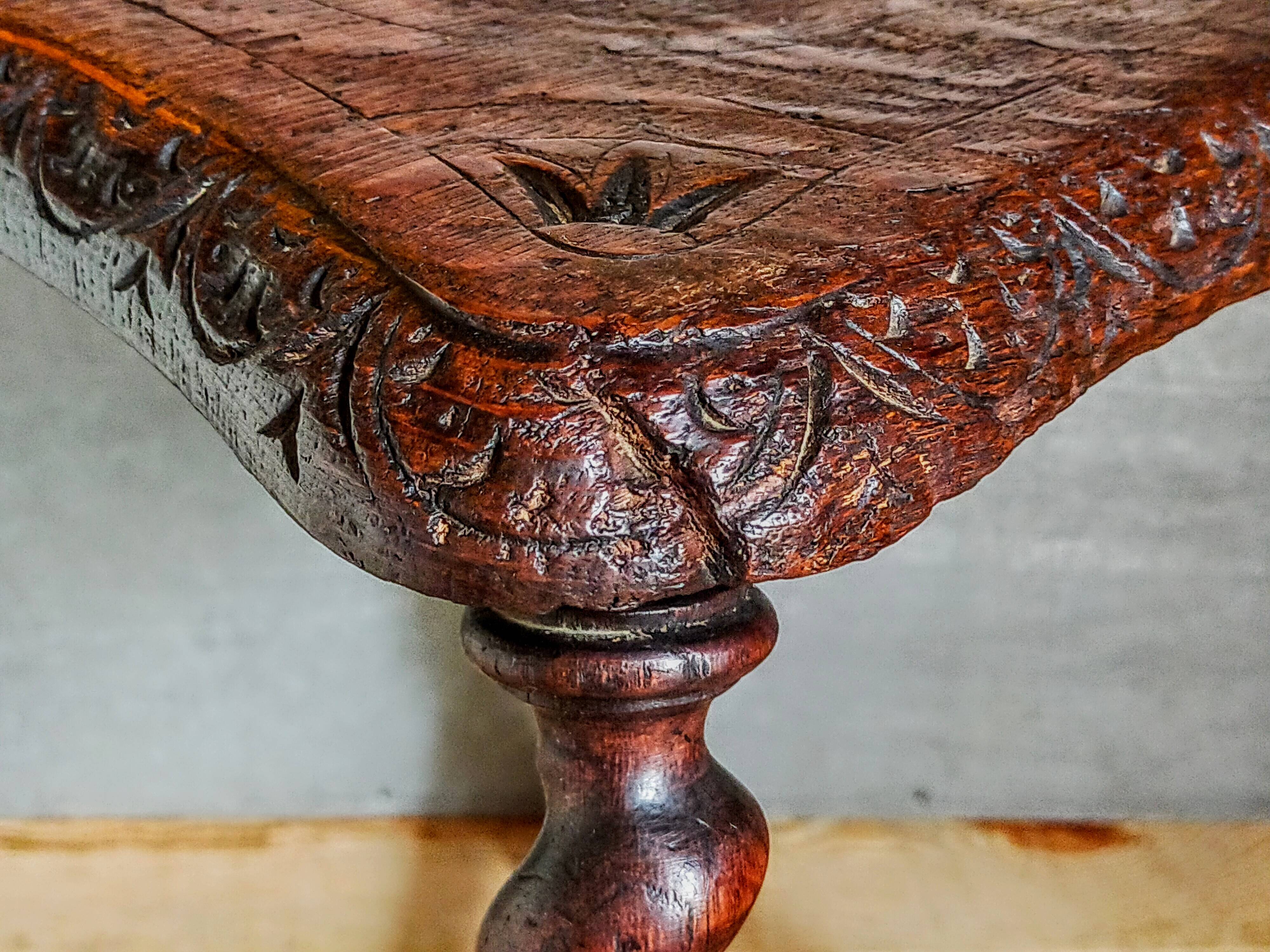 Antique stool in turned and carved solid wood