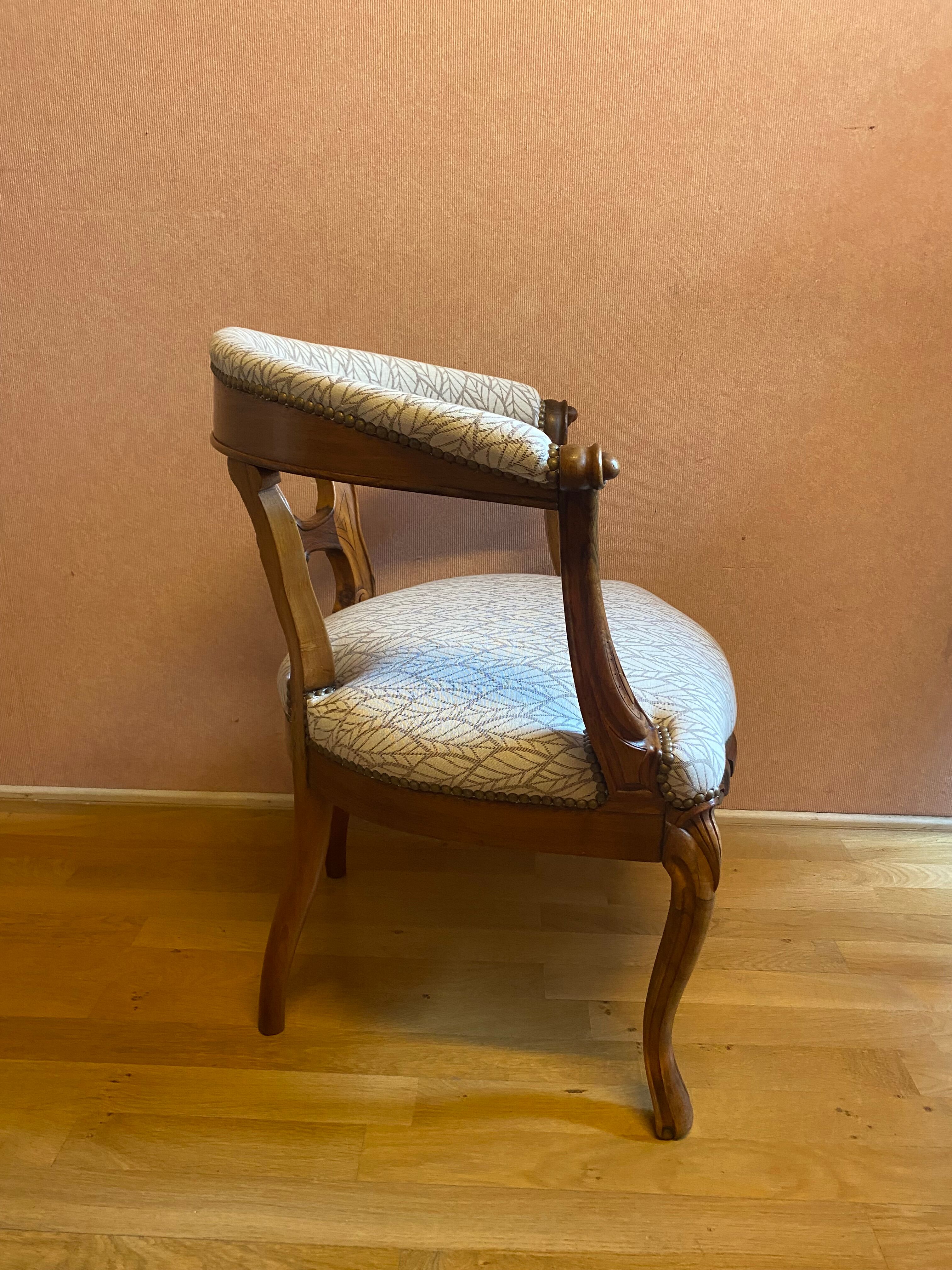 office armchair in walnut, nineteenth century, fully trimmed and reupholstered.