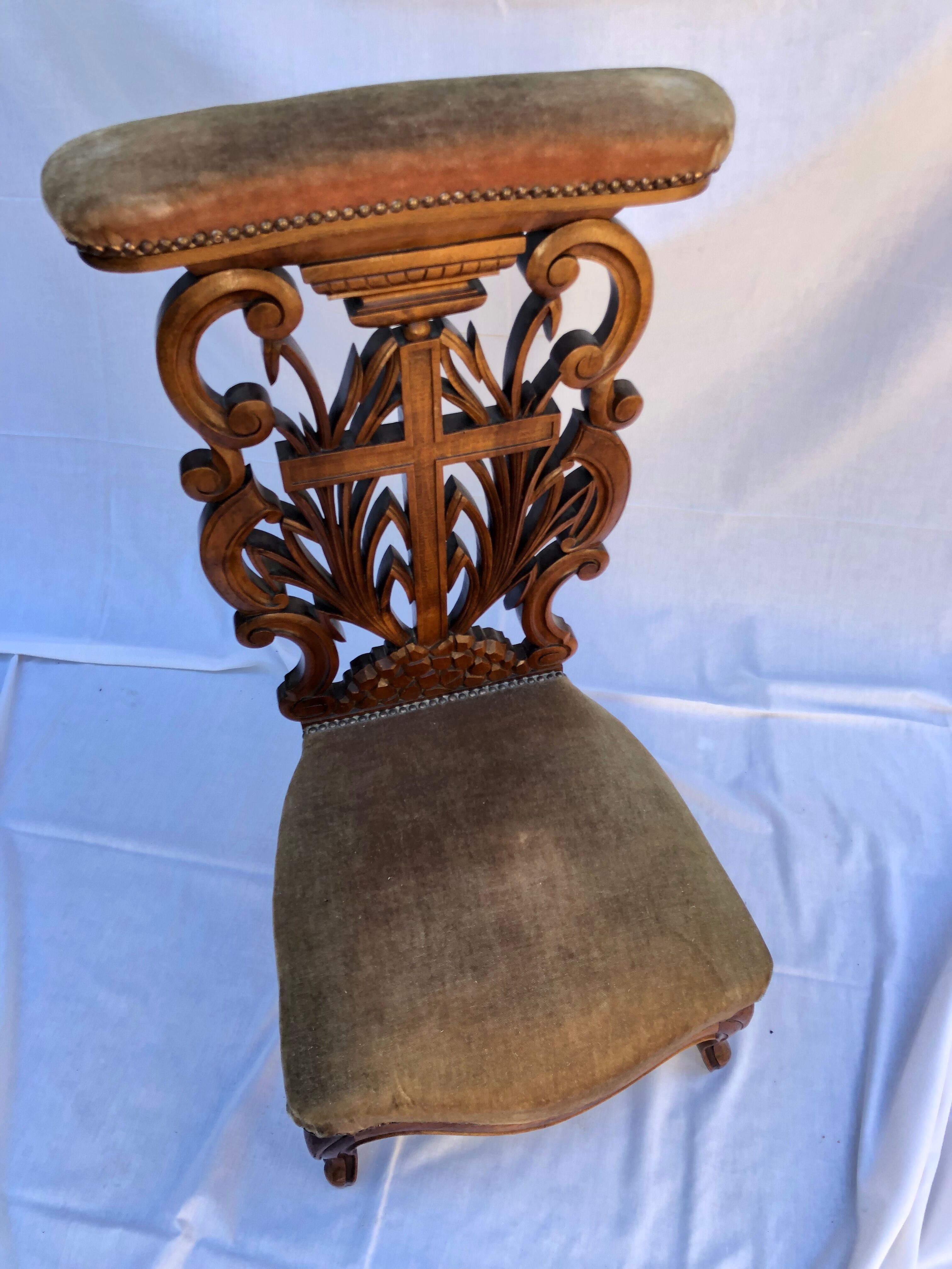 Low armchair in carved wood