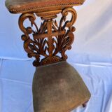 Low armchair in carved wood