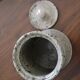 Pot with speckled sandstone lid