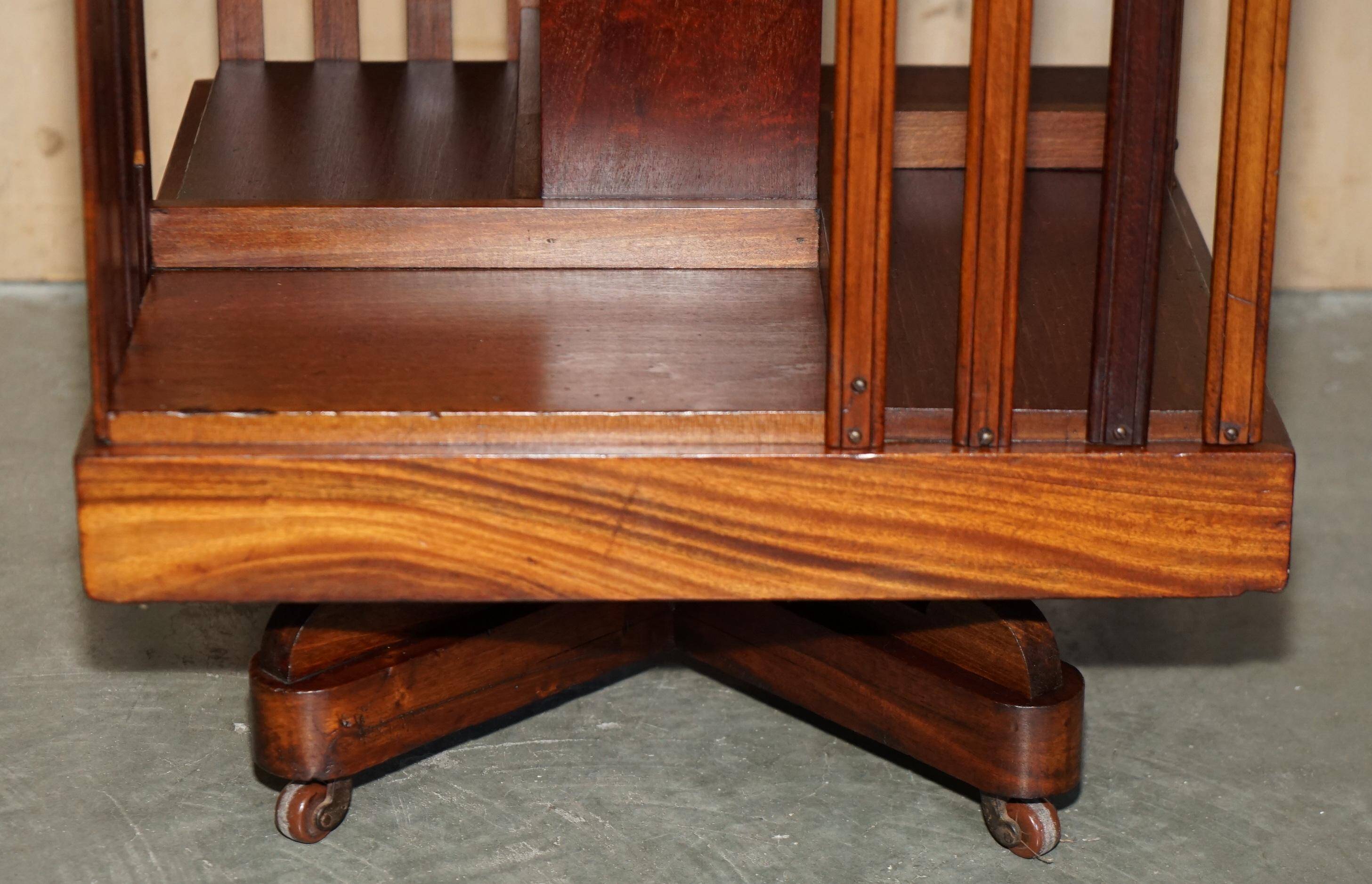 Sheraton-style rotating library table in walnut and satinwood.