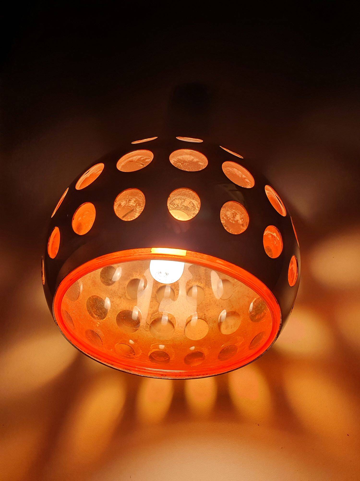 Raak three-light space age orange pendant lamp, 1970s, Netherlands