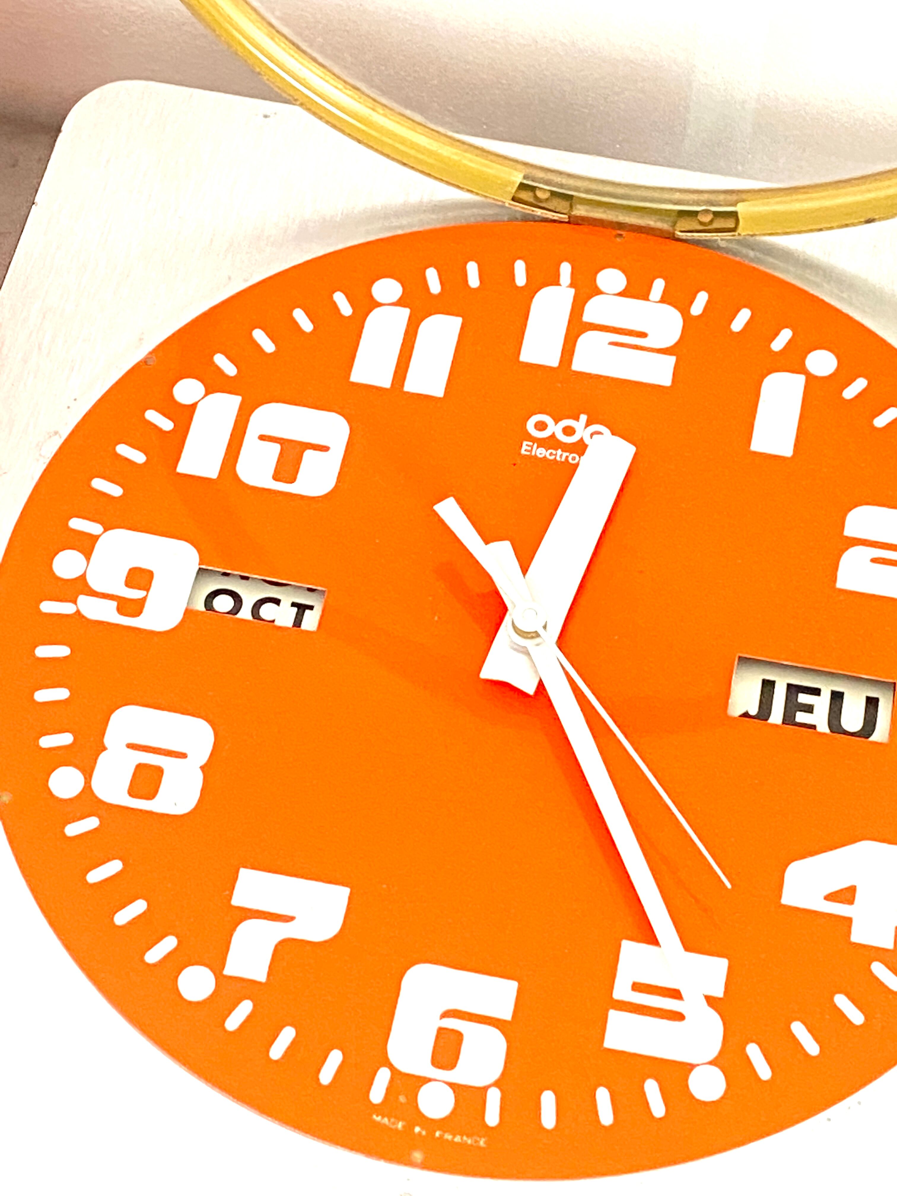 Vintage orange wall clock