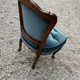 Armchair in walnut and blue velvet