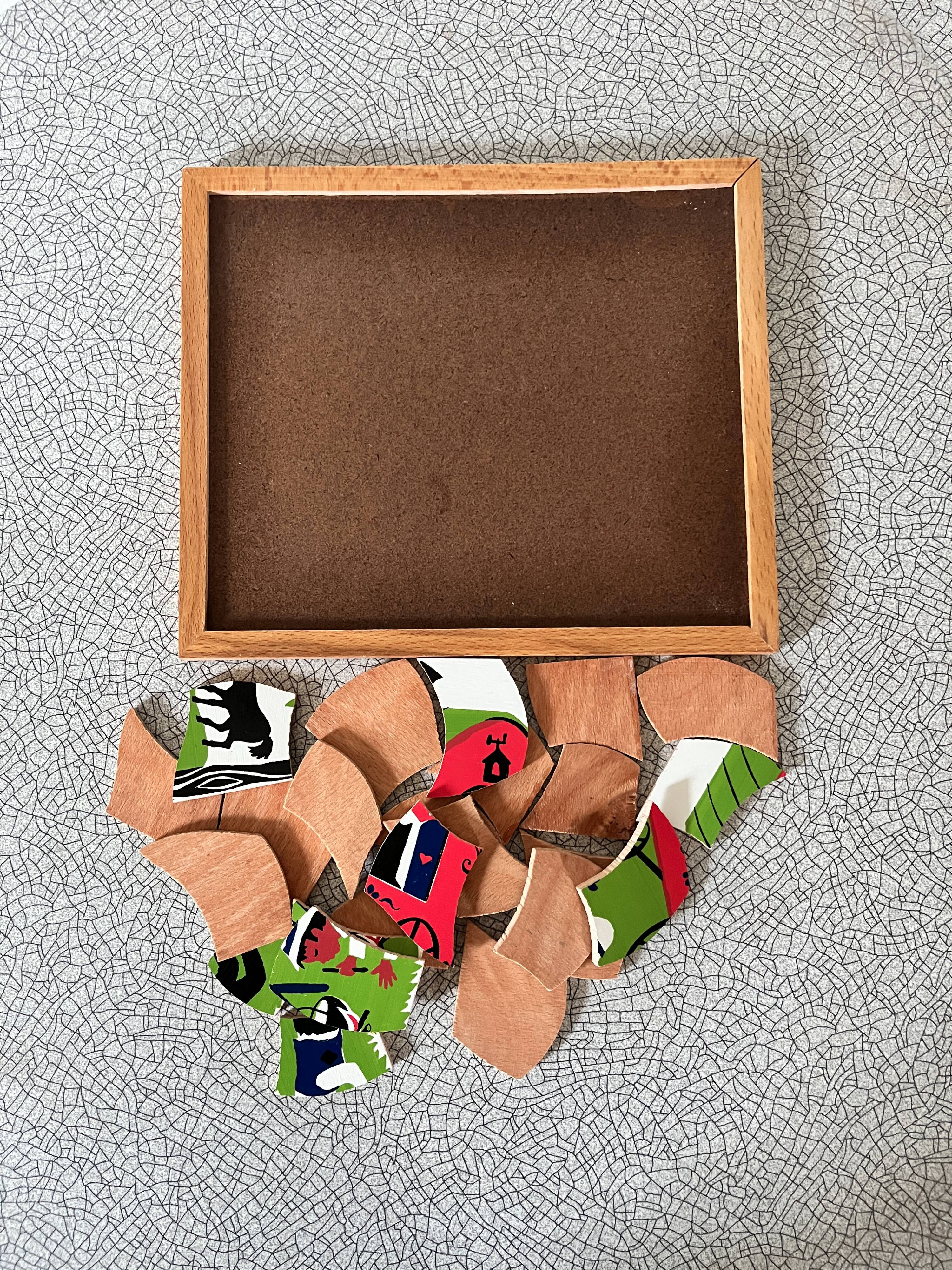 Wooden frame puzzle from the 1940s/50s depicting a caravan campsite.