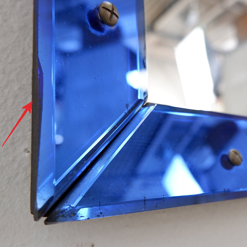 Mirror with a coloured glass frame attributed to Fontana Arte, Italy, circa 1950.