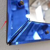 Mirror with a coloured glass frame attributed to Fontana Arte, Italy, circa 1950.