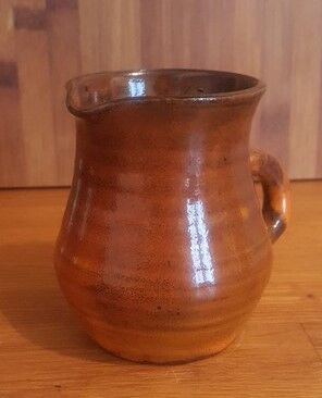 Ceramic milk pot creamer with orange glaze