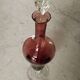 Purple-colored liquor-blown glass decanter with carved foot