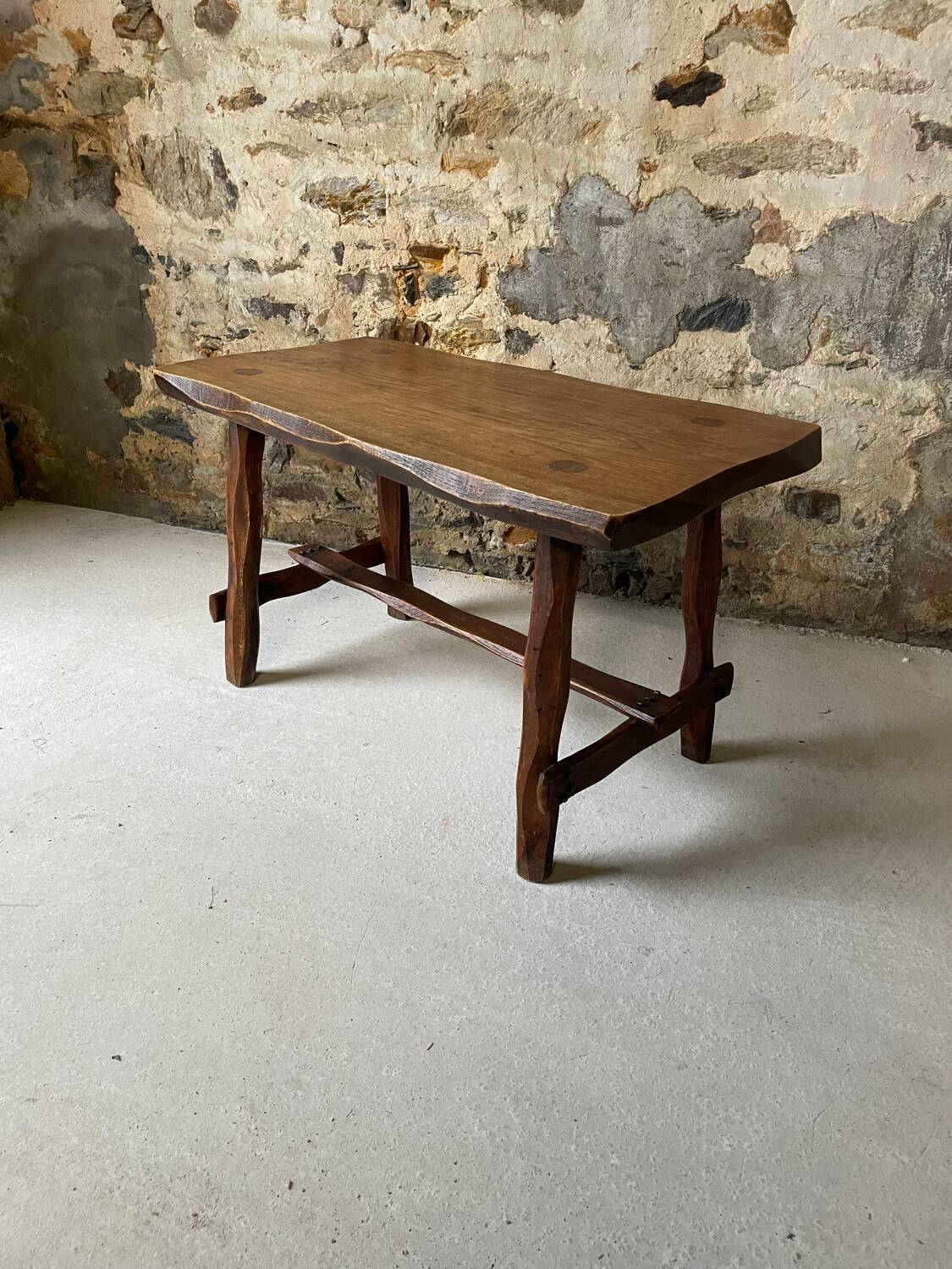Small rustic table made of solid wood.