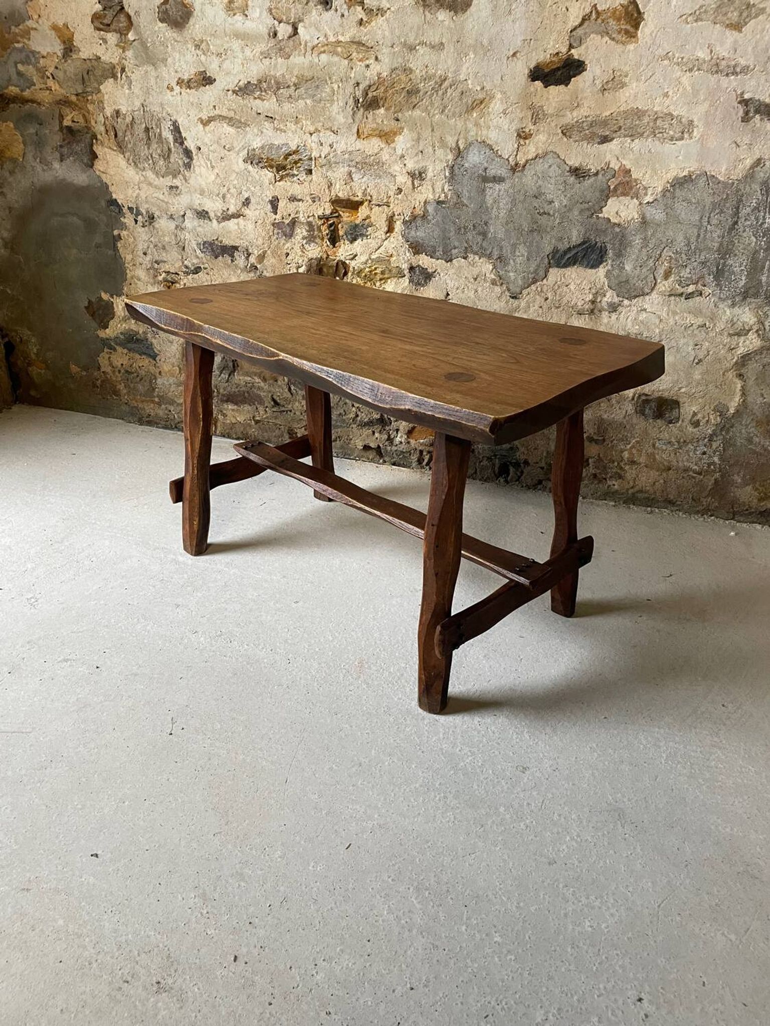 Small rustic table made of solid wood.