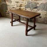 Small rustic table made of solid wood.