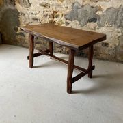 Small rustic table made of solid wood.