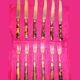 Table art, 12 fruit cutlery sets in gilded metal with horn from the early 20th century.