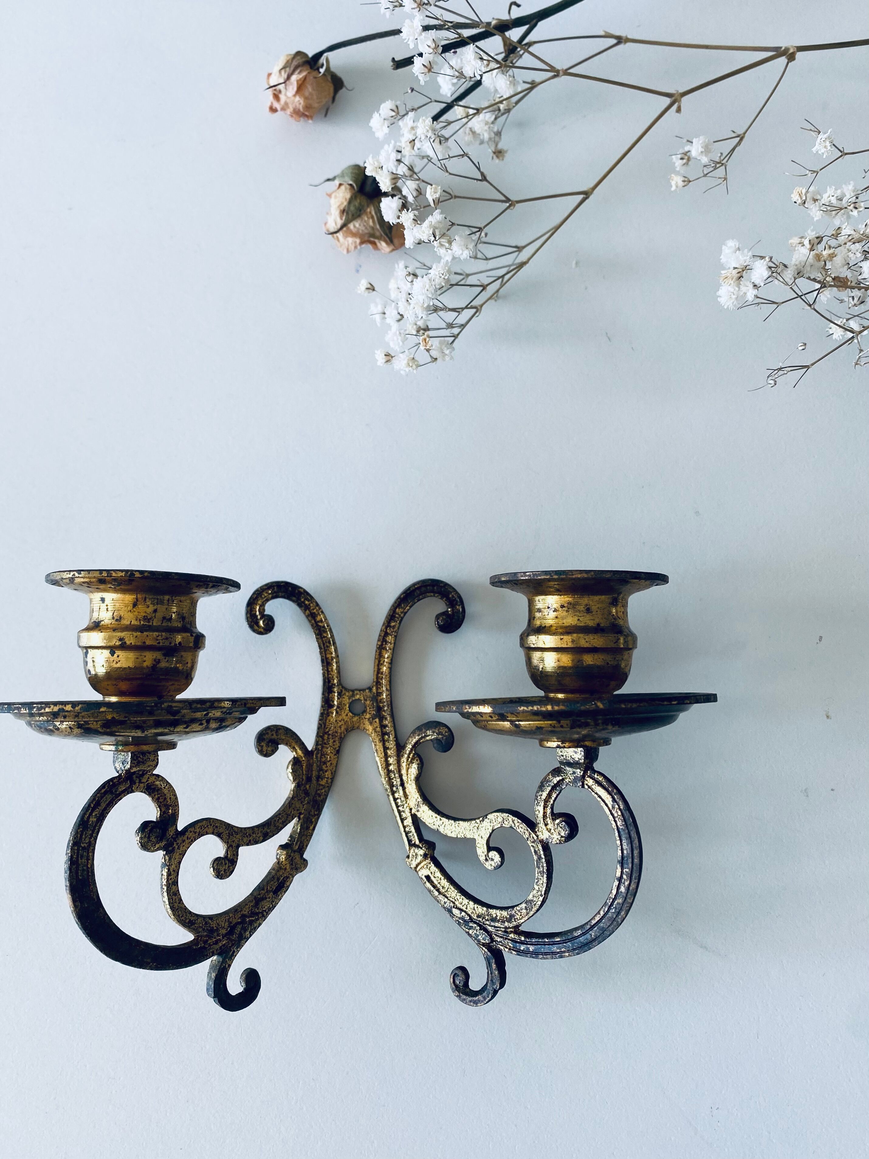Old wall candle holder in golden brass