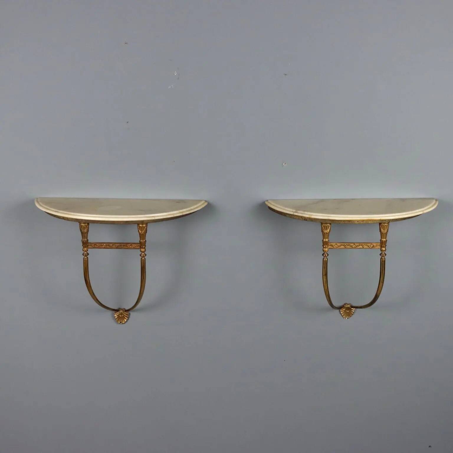 Old neoclassical consoles in gilded bronze from the 20th century.