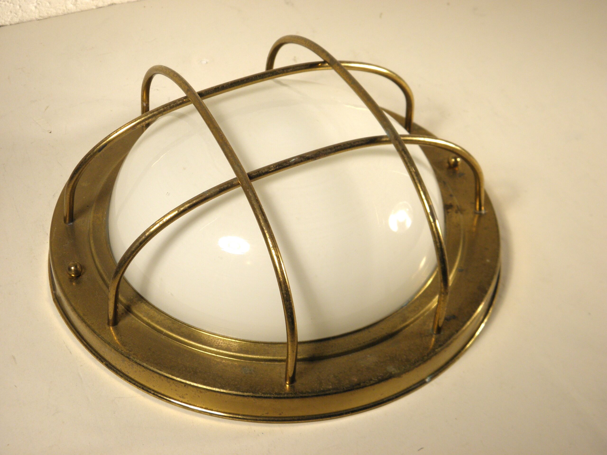 Brass "porthole" wall lamp