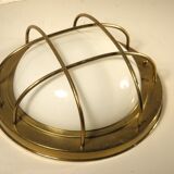 Brass "porthole" wall lamp