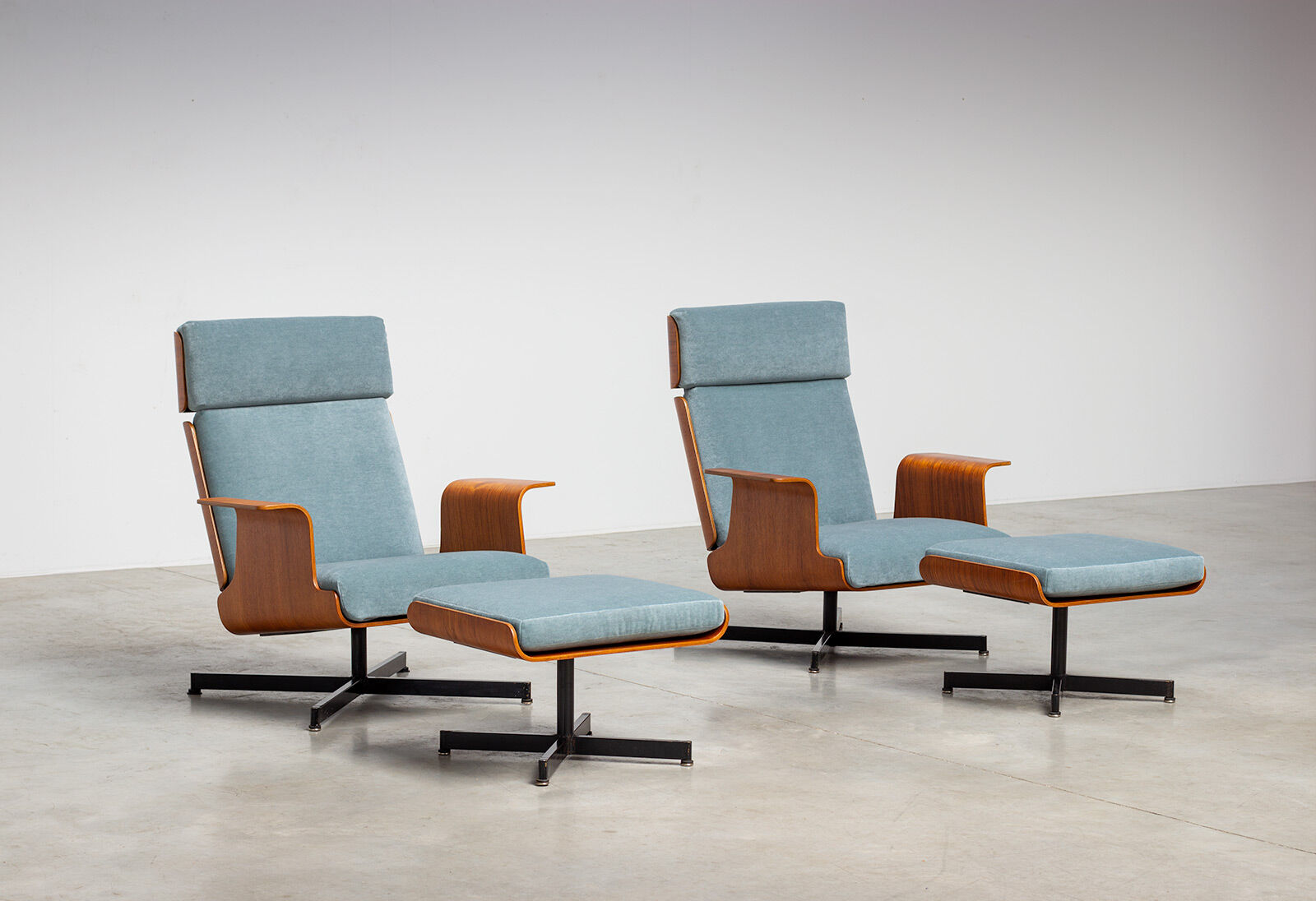 Pair of modernist teak lounge chairs and poufs 1960