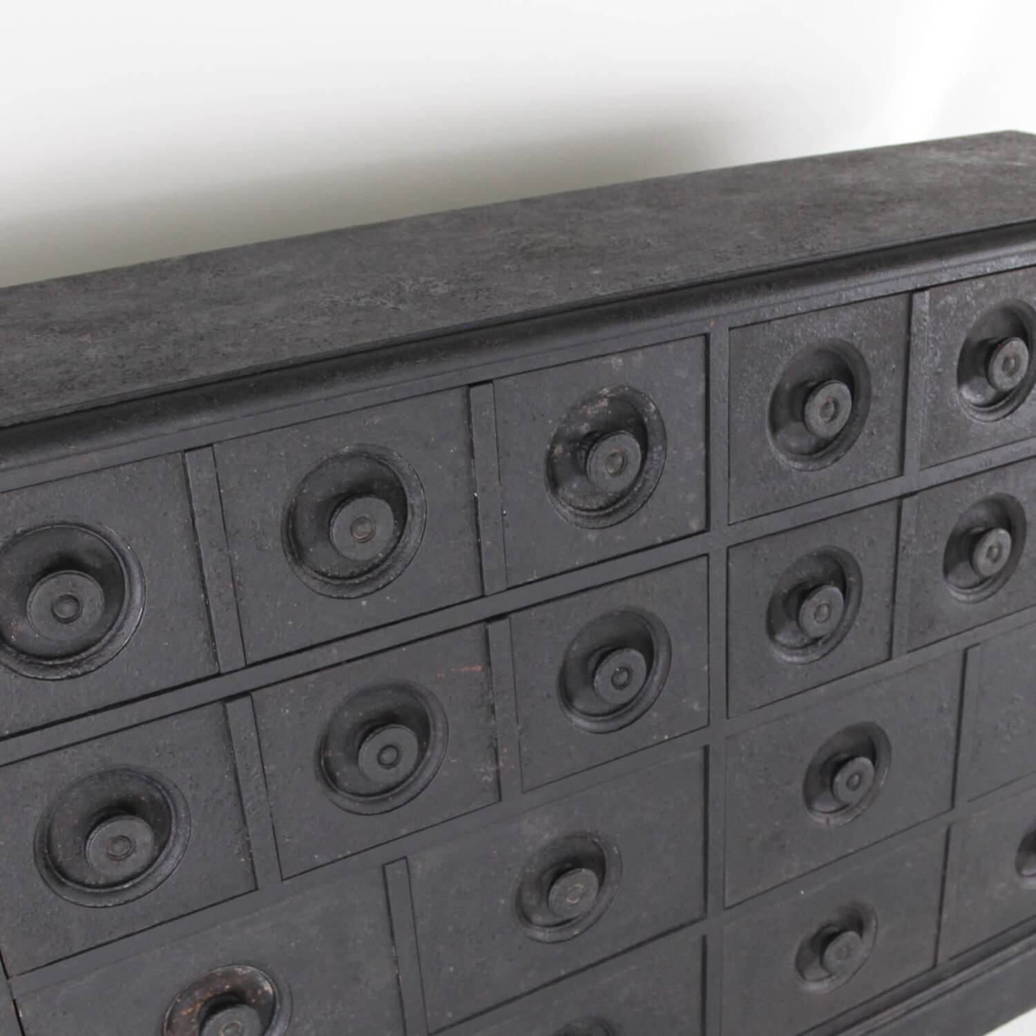 Blackened wooden chest of drawers