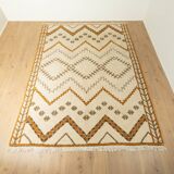 XXL Berber rug with long fringes from the 1960s. Cream-coloured pile with patterns in orange and green tones.