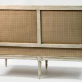 Louis XVI style canapé, in white lacquered wood.