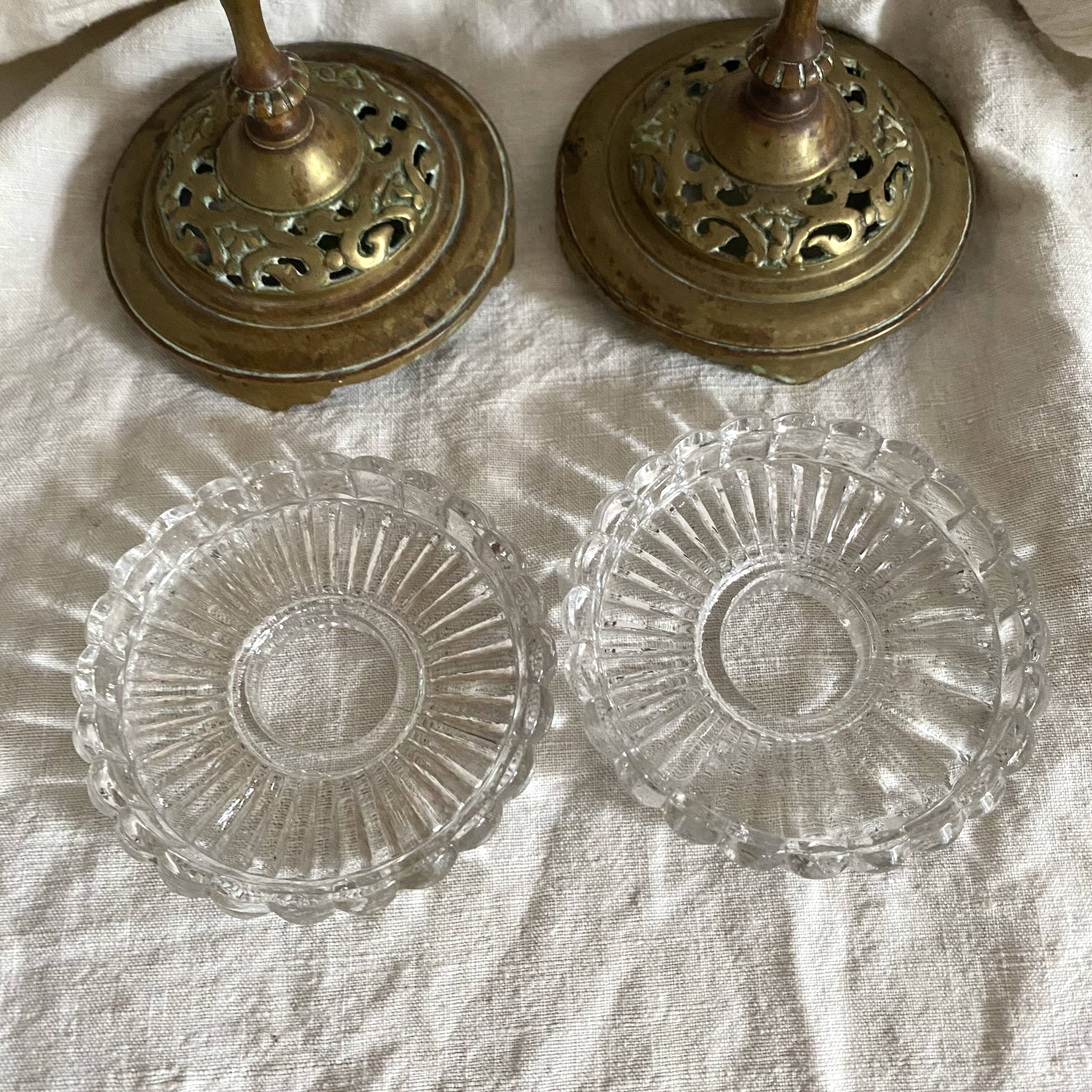 Pair of openwork brass candlesticks and glass bobeches