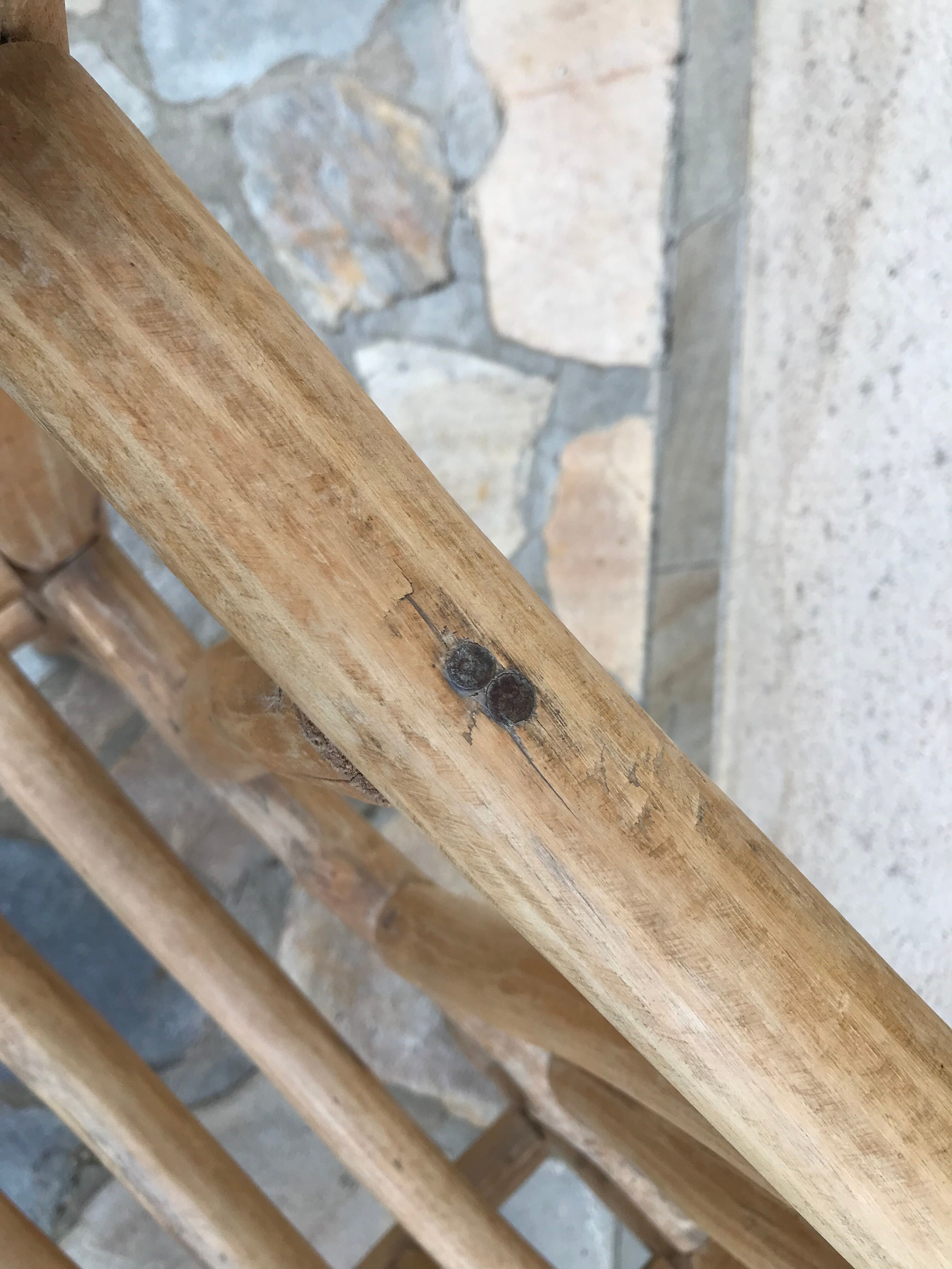 Art-Populaire armchair in raw wood, circa 1950.