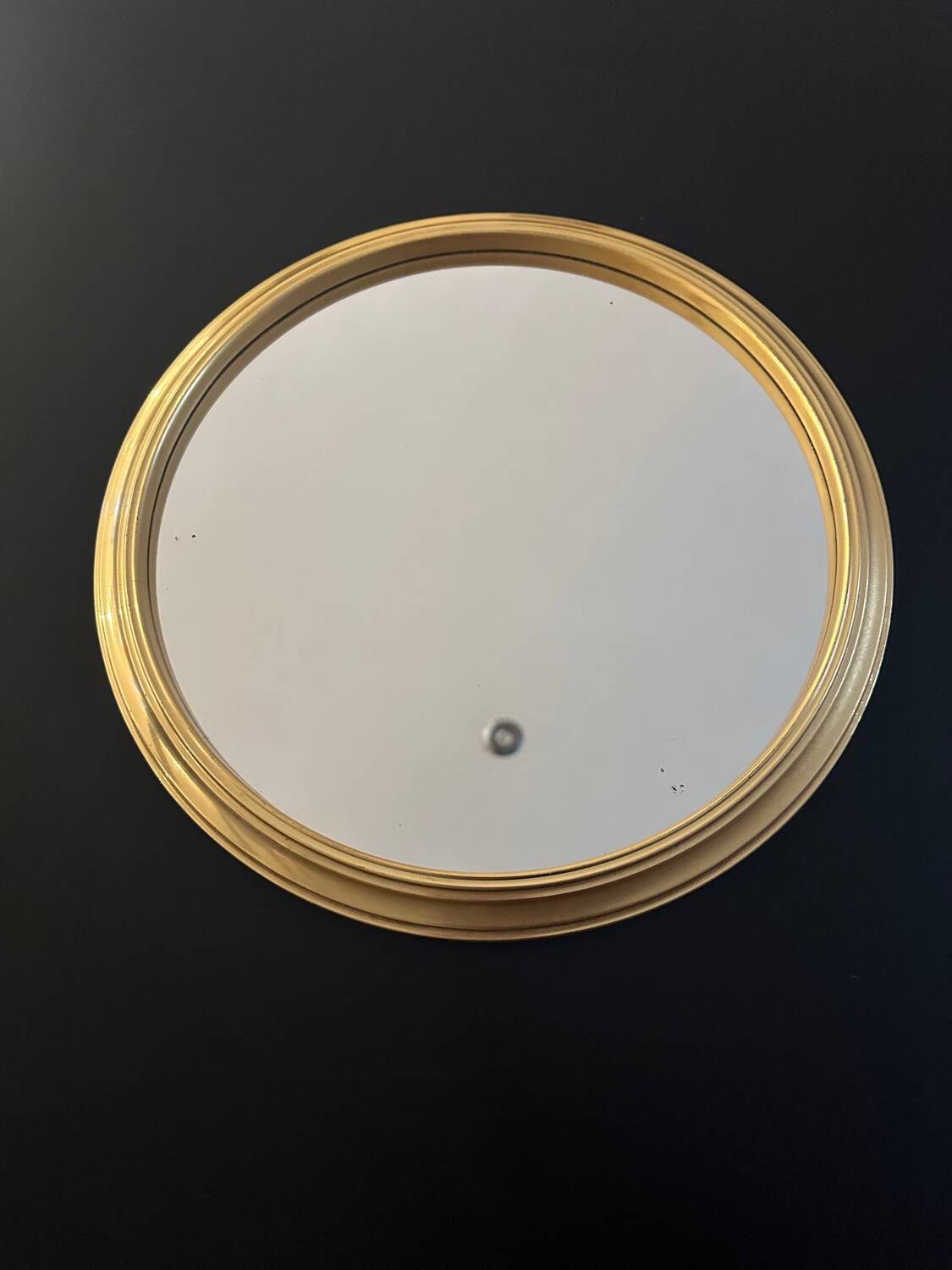Round golden mirror