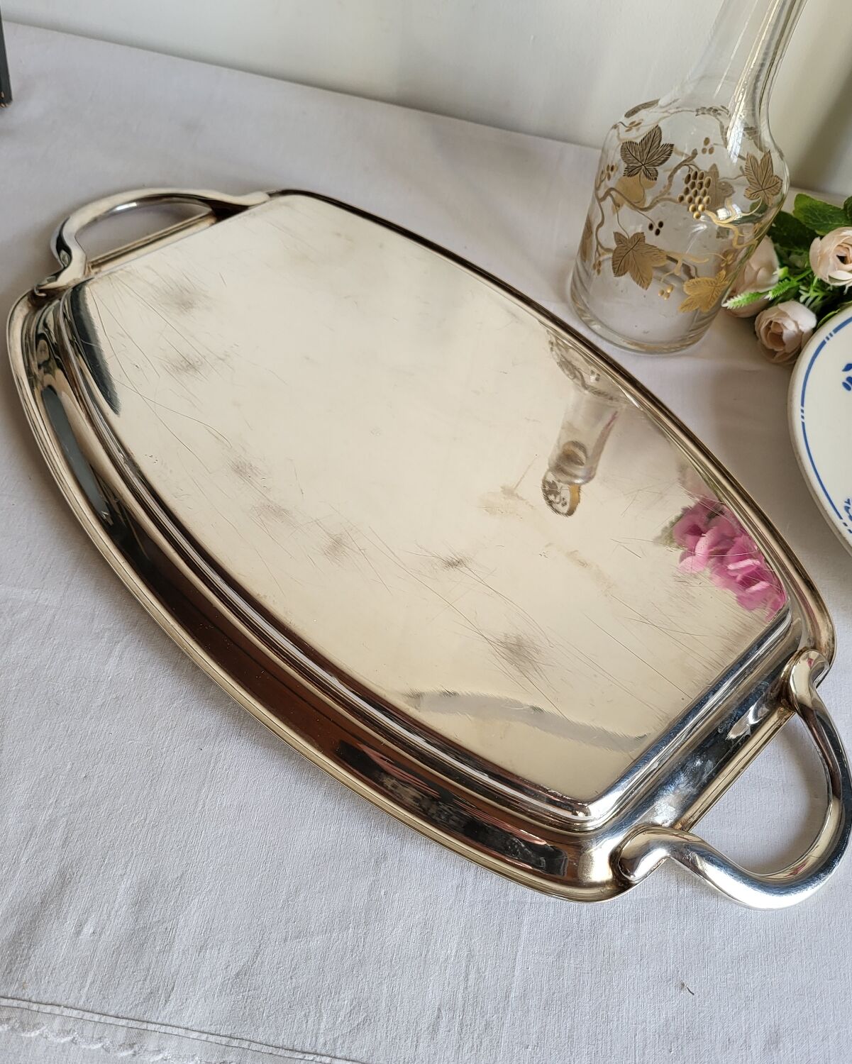 Silver-plated serving dish Quist and its asparagus cradle grid.