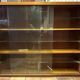 Small vintage wall display cabinet in wood and glass – mixed shelves