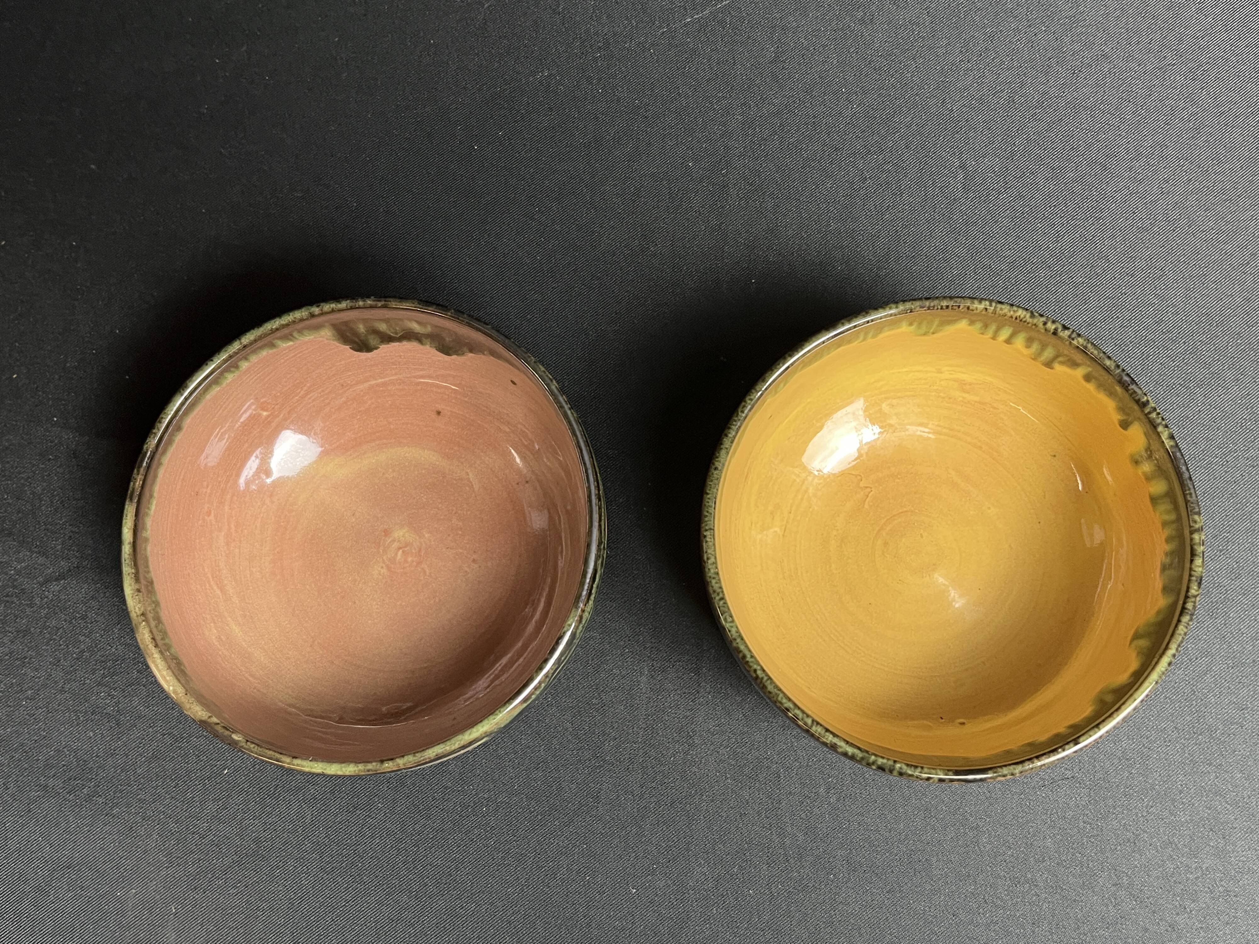 Vintage, two flamed stoneware bowls from the 20th century.