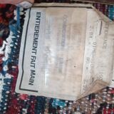 Vintage oriental rug from the 1930s. Handcrafted, handmade. Worn.