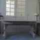Console table in walnut with drop-leaf extensions, grey patinated base.