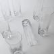 Vintage set of 9 Murano glasses from the 1980s, octagonal shape in art glass, classic Italian tableware.