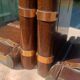 Wooden trompe-l'œil bookends with a book and box