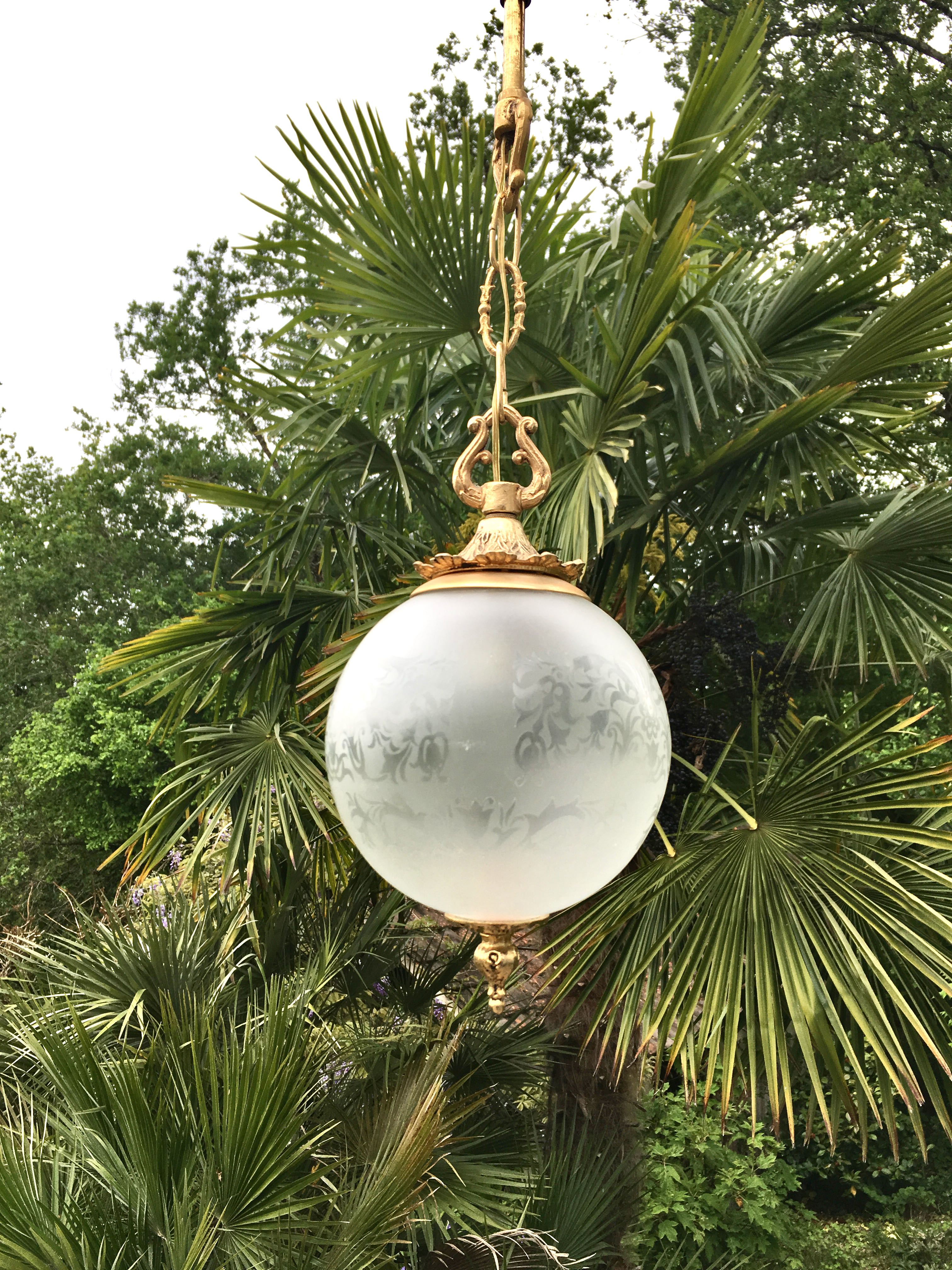 Floral globe and gold metal hanging lamp