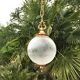 Floral globe and gold metal hanging lamp