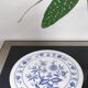 Vintage round trivet with blue floral pattern - 1970s