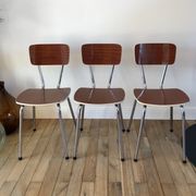 Trio of chairs in light brown formica and cream contour 70s