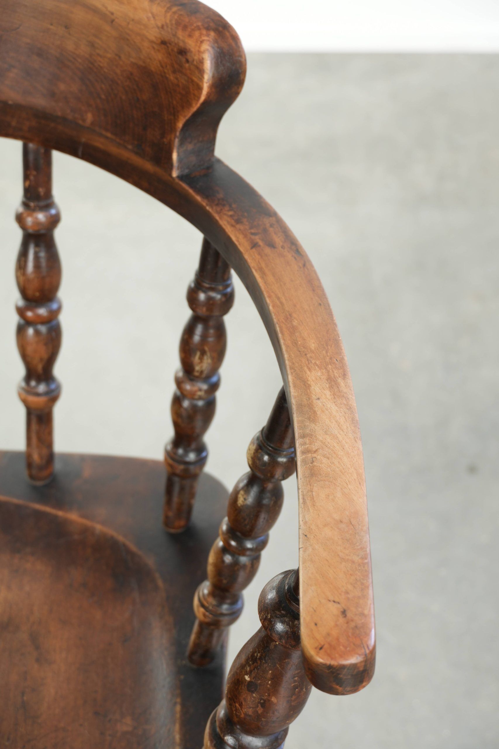 Wooden English antique pub/captain chair from the late 19th century