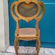 Antique rococo chair in gilded wood and caning