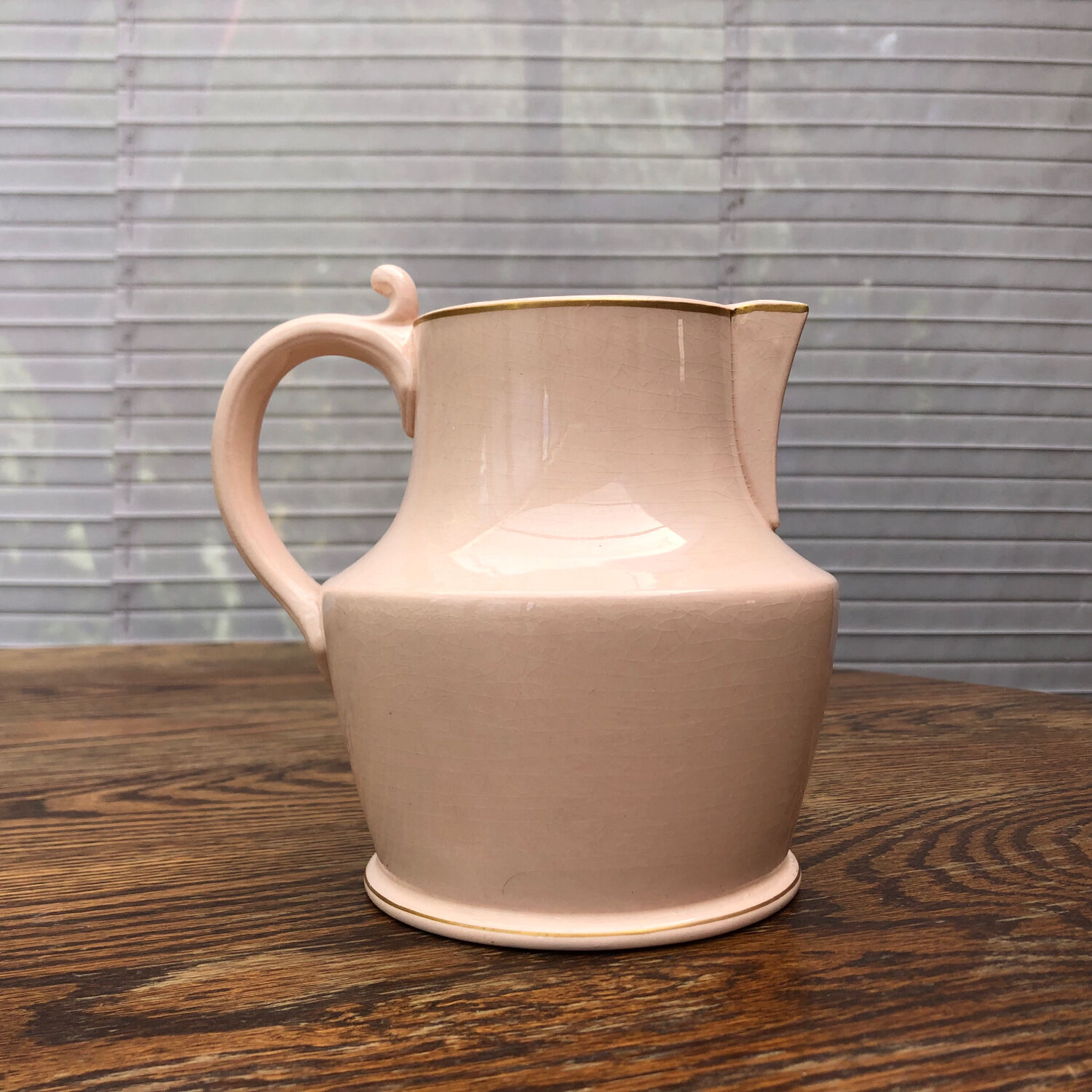 Antique pitcher in pink ceramic