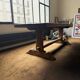 Large antique farmhouse table made of solid wood, in monastery style.