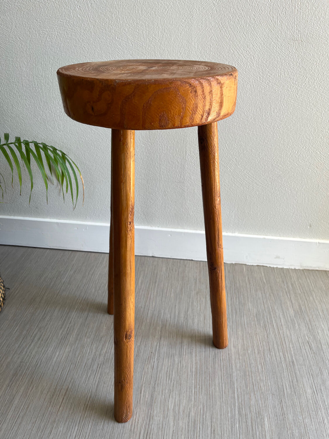 Tripod stool in a brutalist style