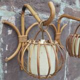 Pair of Louis Sognot rattan wall lights.