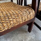 Set of two colonial dark-brown wooden armchairs with natural rattan seating (pair)